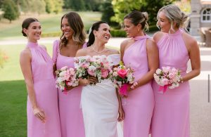 Bride and bridesmaids outdoors showing photo-ready wedding makeup in natural light