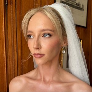 Close-up luxury bridal makeup with soft eyeliner and natural glow